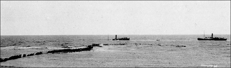 07 rhos-on_sea_view_with_rhosneigr_wreck